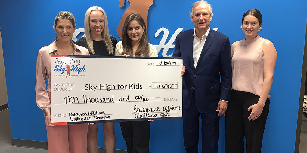 EOD presenting a donation to Sky High for Kids
